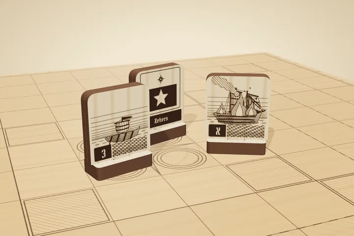 Engraved wooden ship tiles standing on an engraved chart